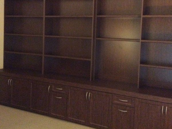 A room with a lot of shelves and cabinets