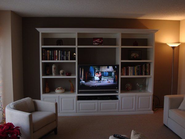 A living room filled with furniture and a flat screen tv