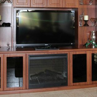 A living room with a fireplace and a flat screen tv