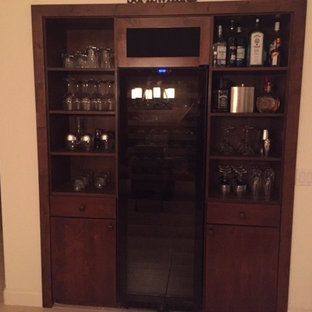 A closet filled with wine bottles and glasses