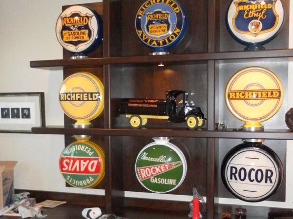 A collection of gas pumps including one for rocket gasoline