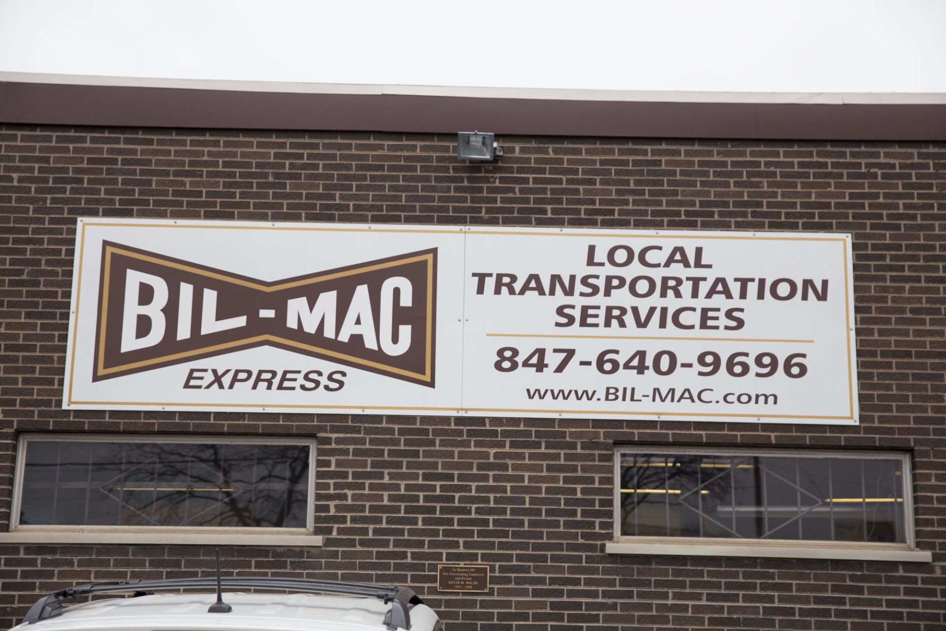 A bill mac express sign on a brick building