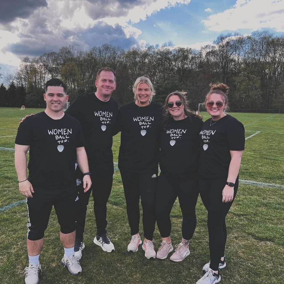 Buckingham United staff on the field in Women Ball Too shirts