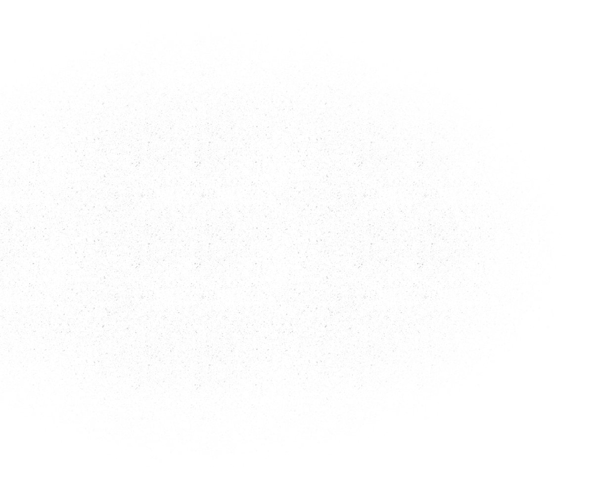 Mostly white blank surface with a faint gray speckled texture near the top.