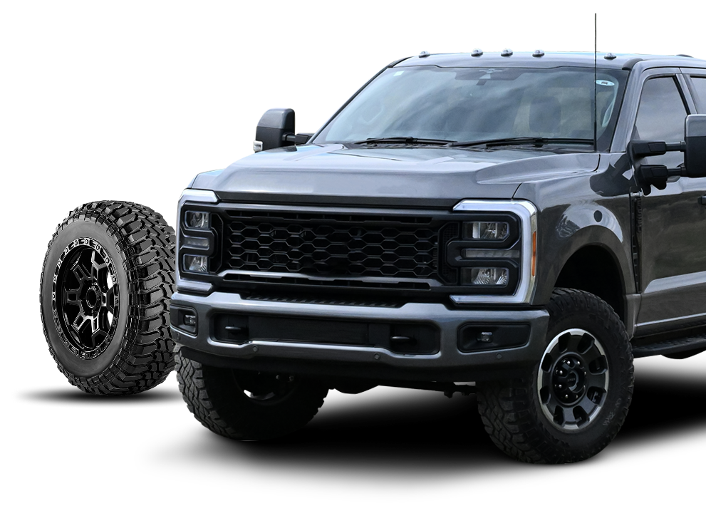 Black lifted pickup truck with large off-road tires on a white background