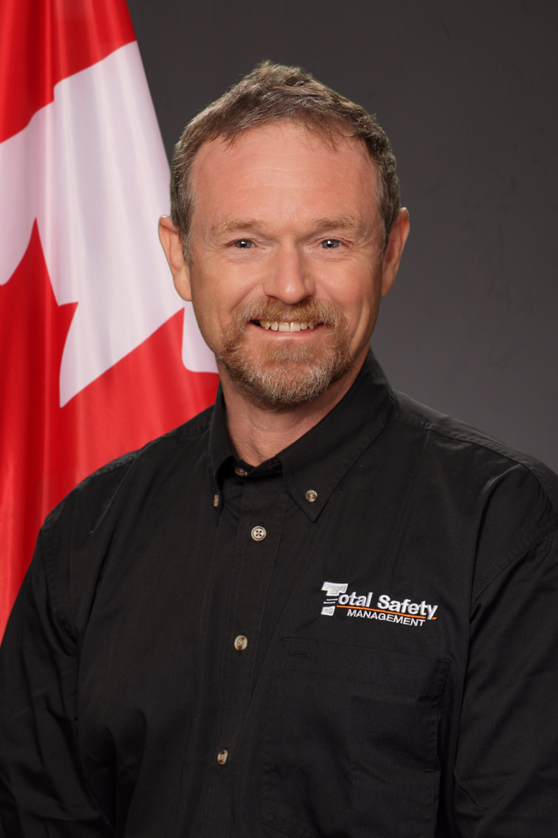 A man wearing a black shirt with the word instructor on it