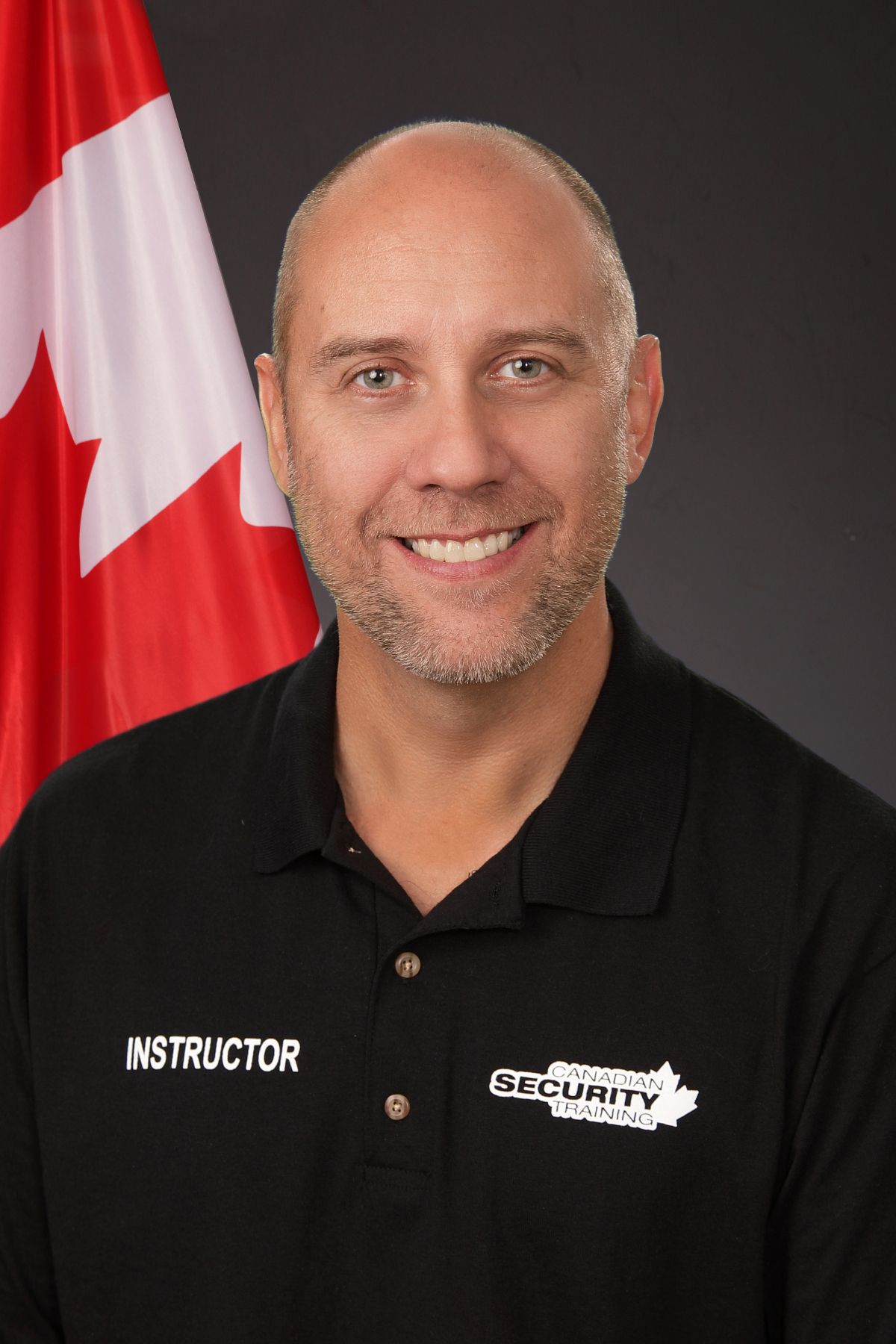 A man wearing a black shirt with the word instructor on it