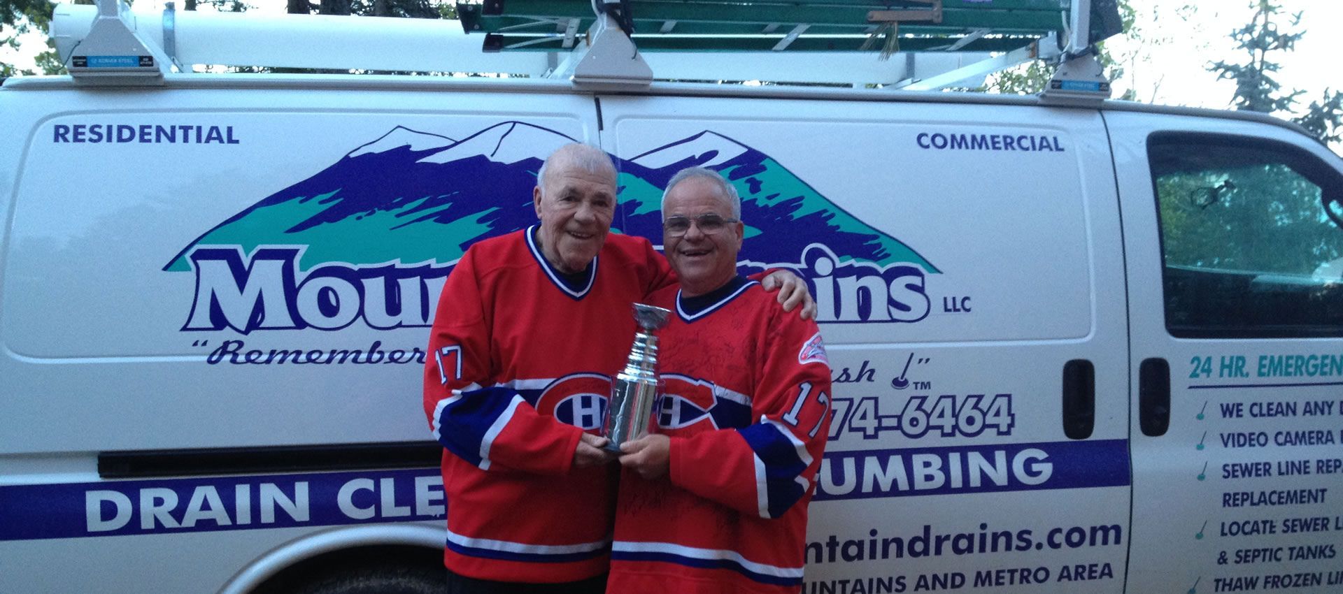 Two Senior Citizen Holding a Trophy - Evergreen, CO - Mountain Drains LLC
