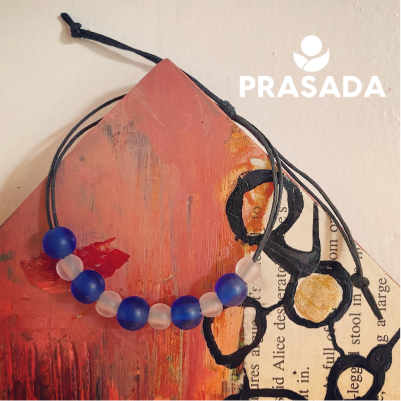 A person is writing on a piece of paper with a pen