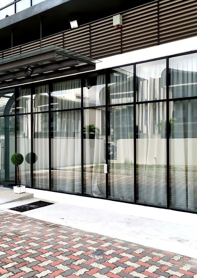 Blue and black Apex Roofing Systems truck in a shop, with the company logo and phone number visible.