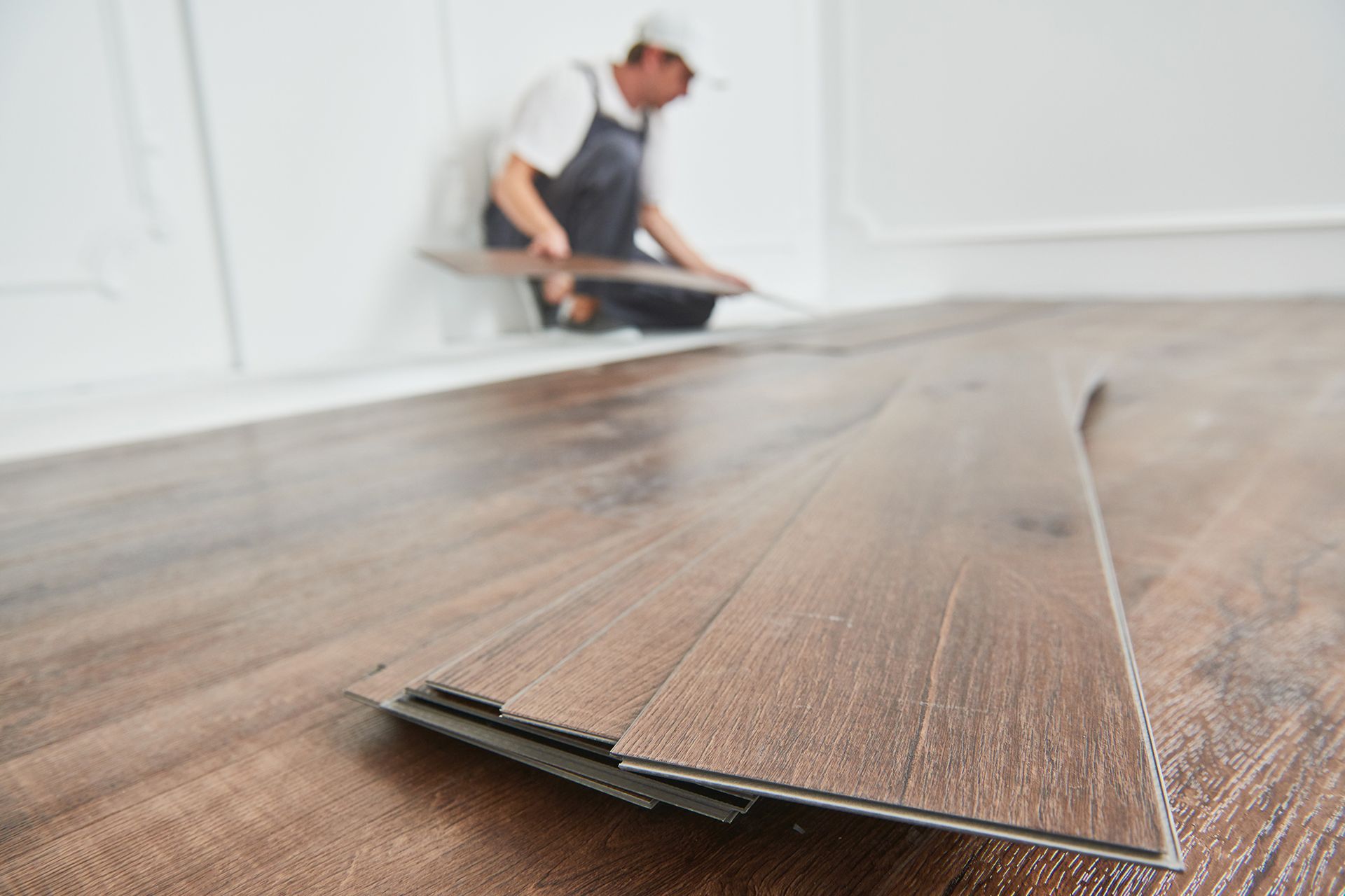 Worker Laying Vinyl Floor