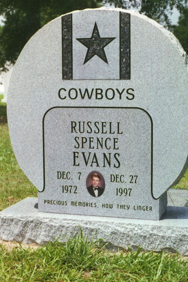 A gravestone for russell spence evans who died in 1997