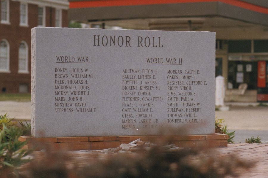 A stone plaque with the words honor roll on it