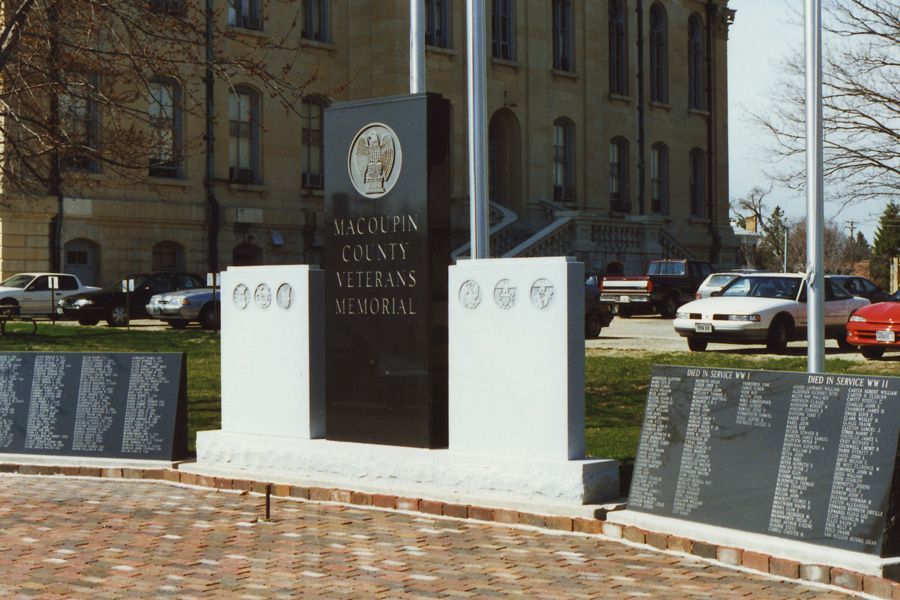 A veterans memorial in front of a large building