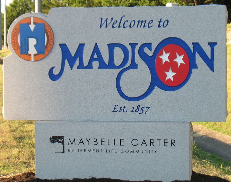 A sign that says welcome to madison on it