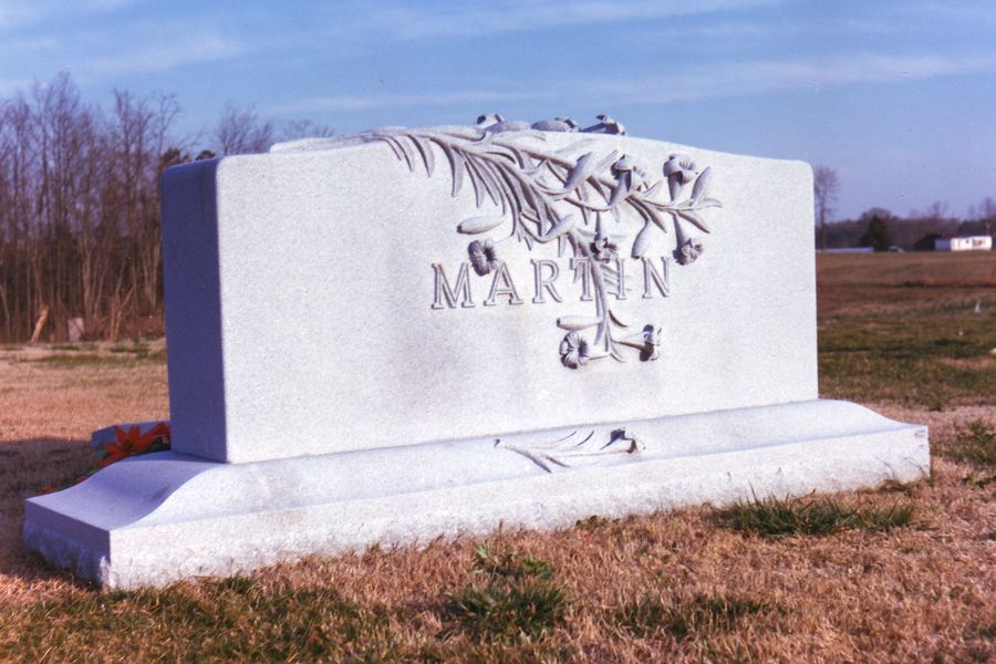 A white gravestone with the name martin on it