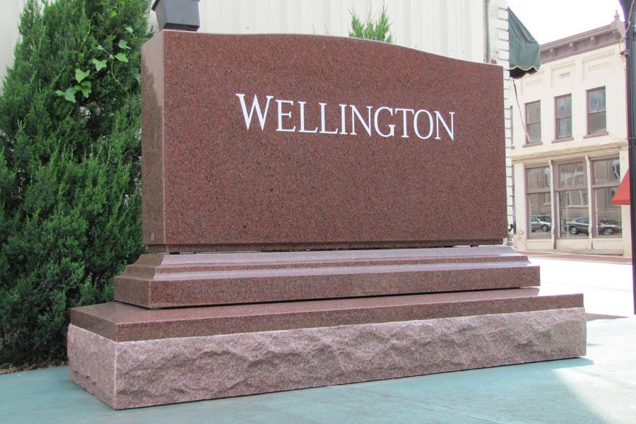 A large red sign that says wellington on it