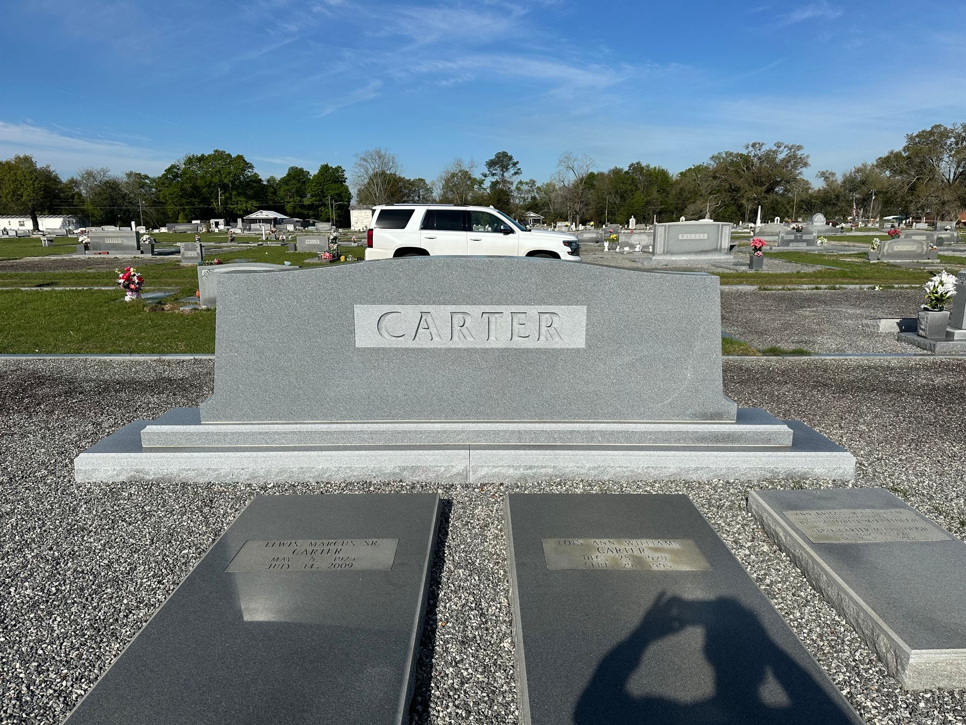 A grave in a cemetery with the name carter on it