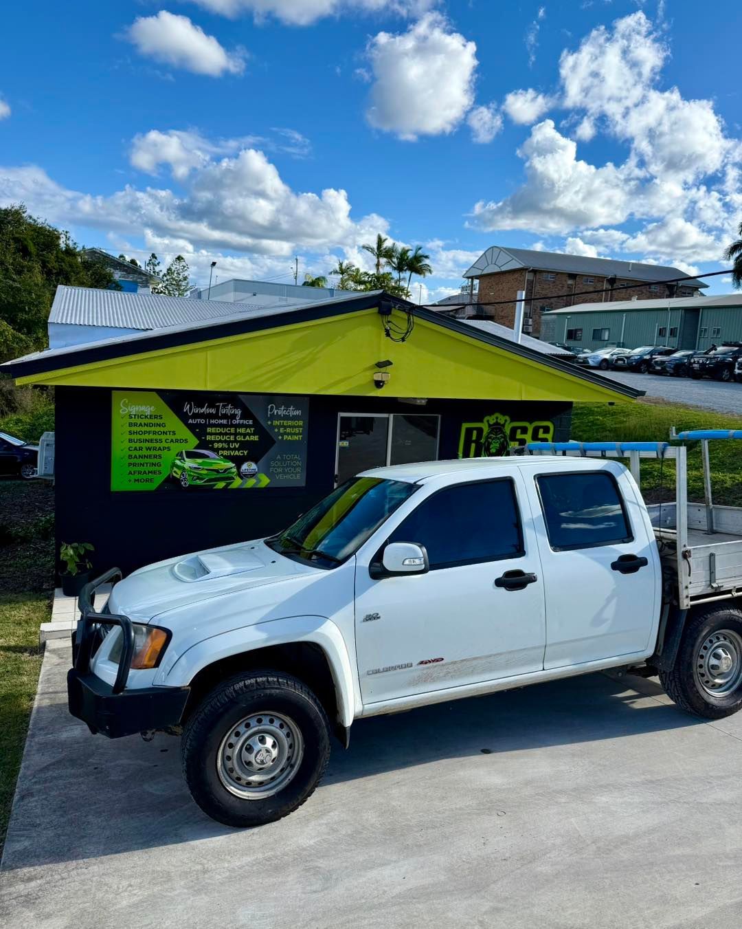 White Pickup Truck Parked in Front of a Building — Boss Signs & Tint in Gympie, QLD
