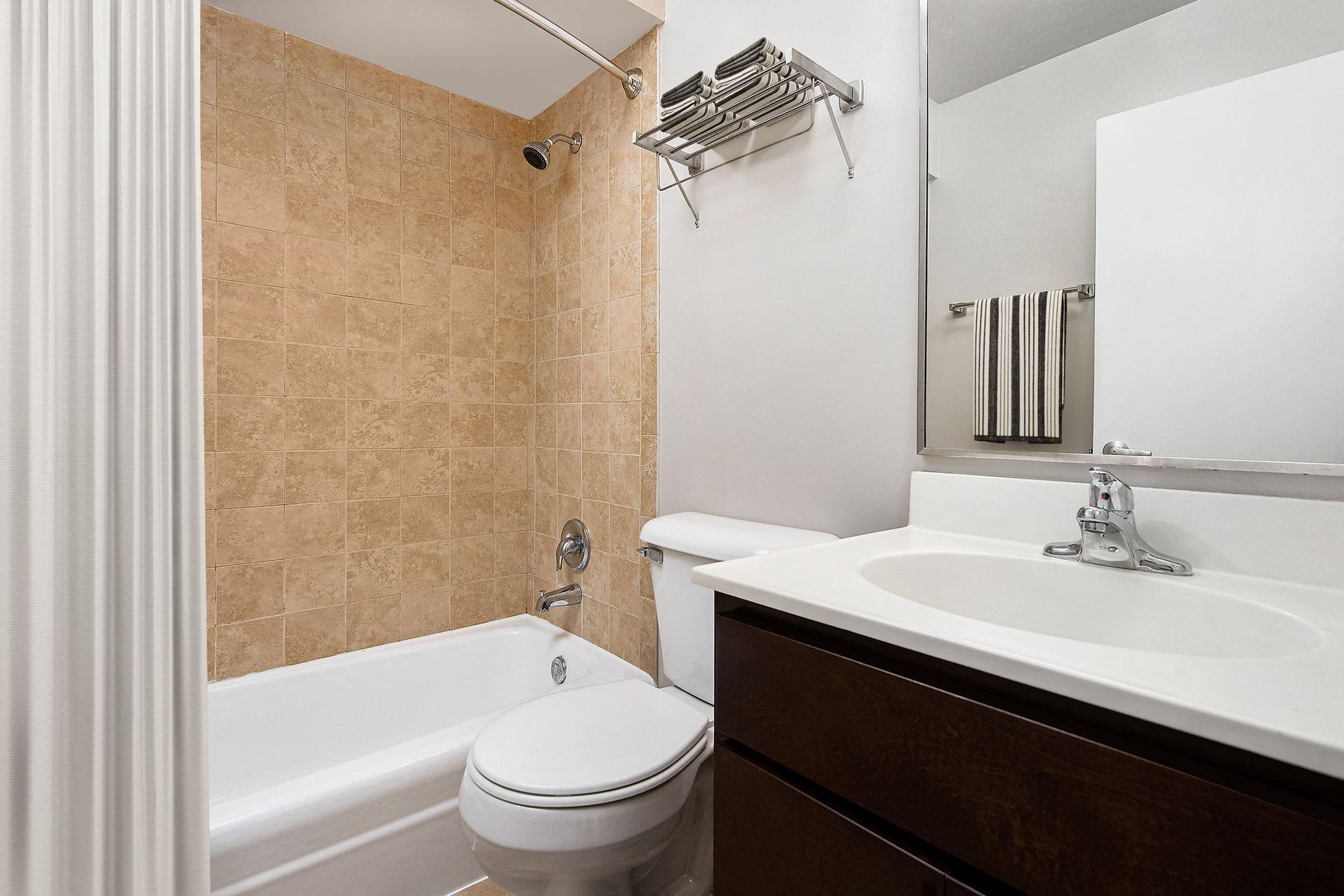 a bathroom with a sink toilet and a tub