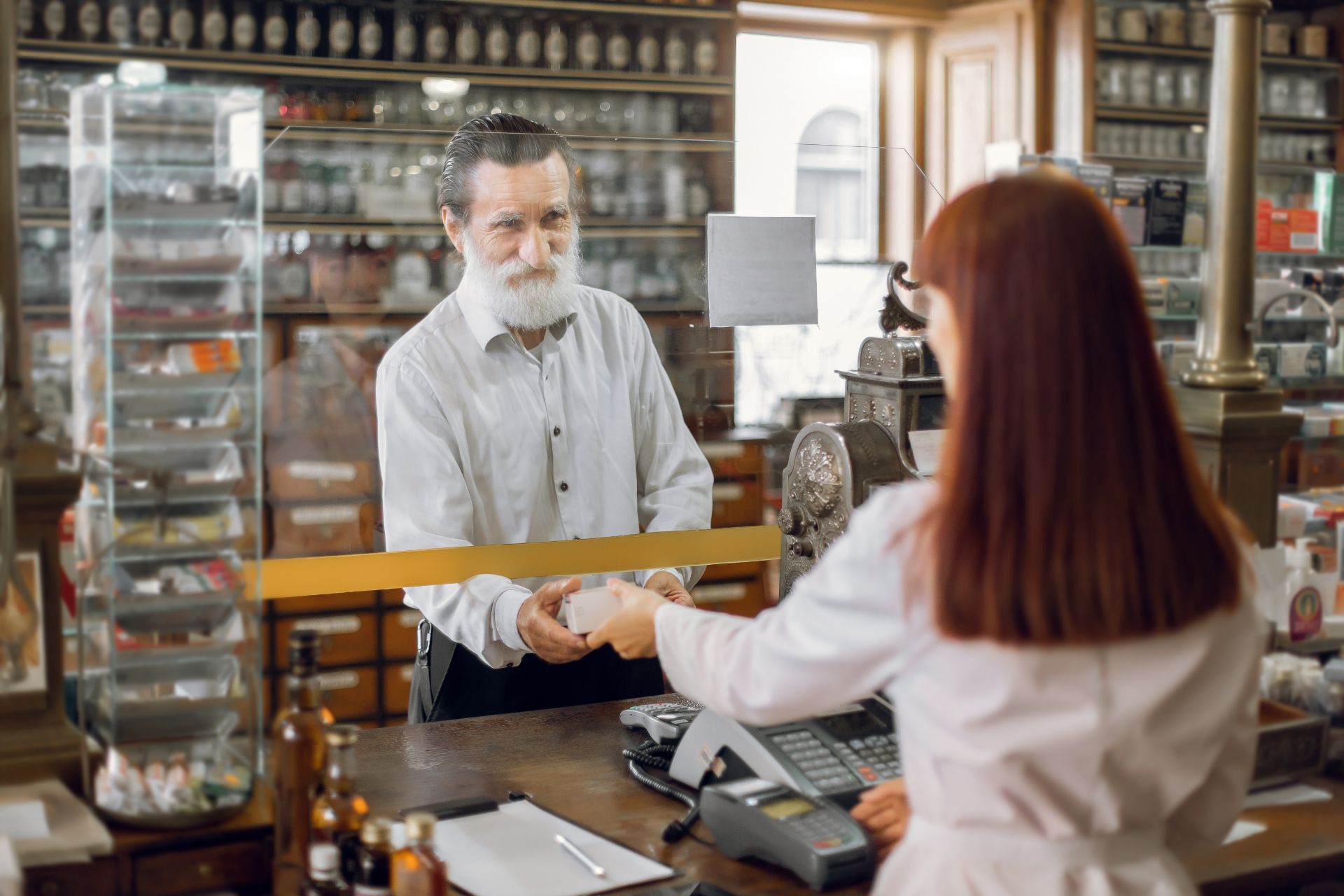 pharmacist dispensing meds to customer