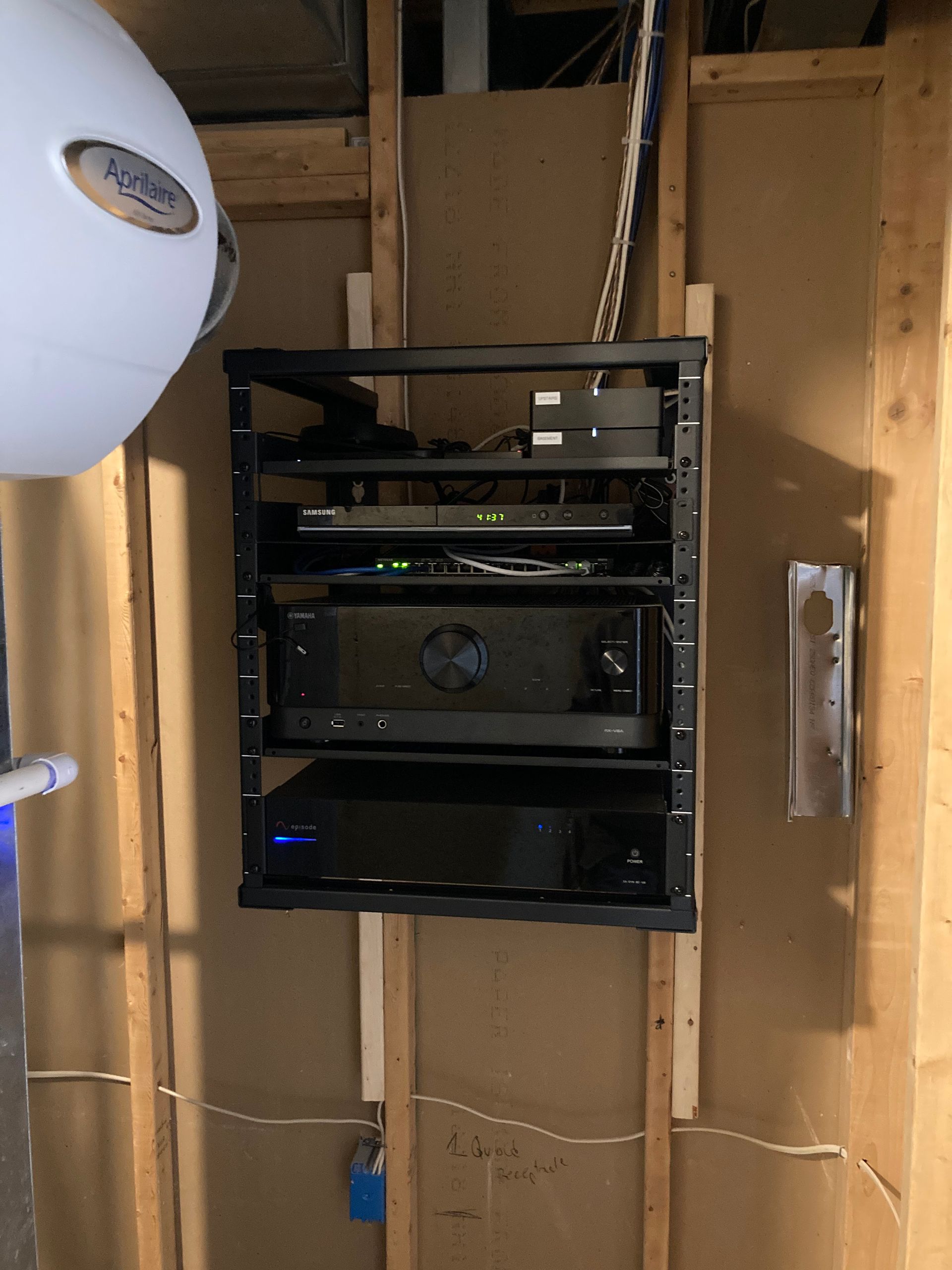 A shelf with a lot of electronics on it