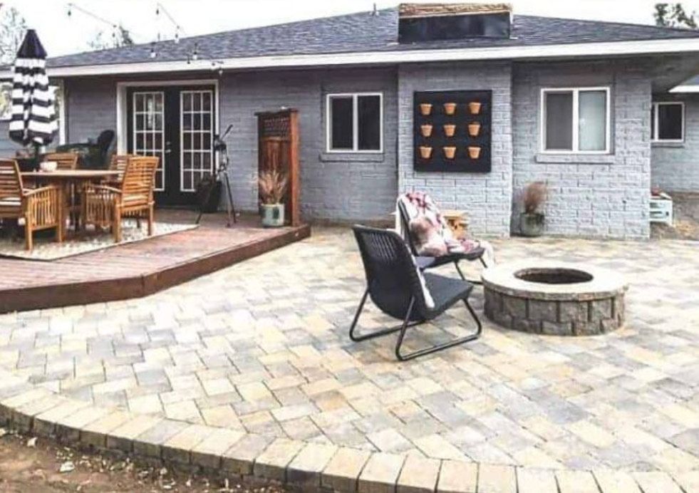 A car is parked in front of a house with a lush green lawn.