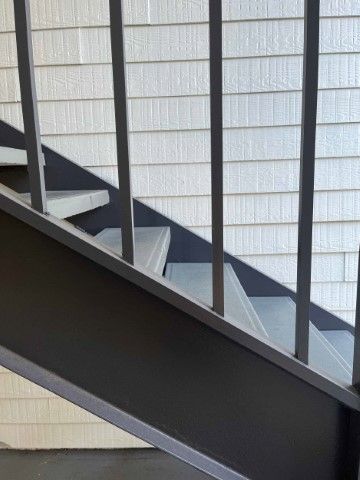 Contemporary stair design with concrete and aluminum