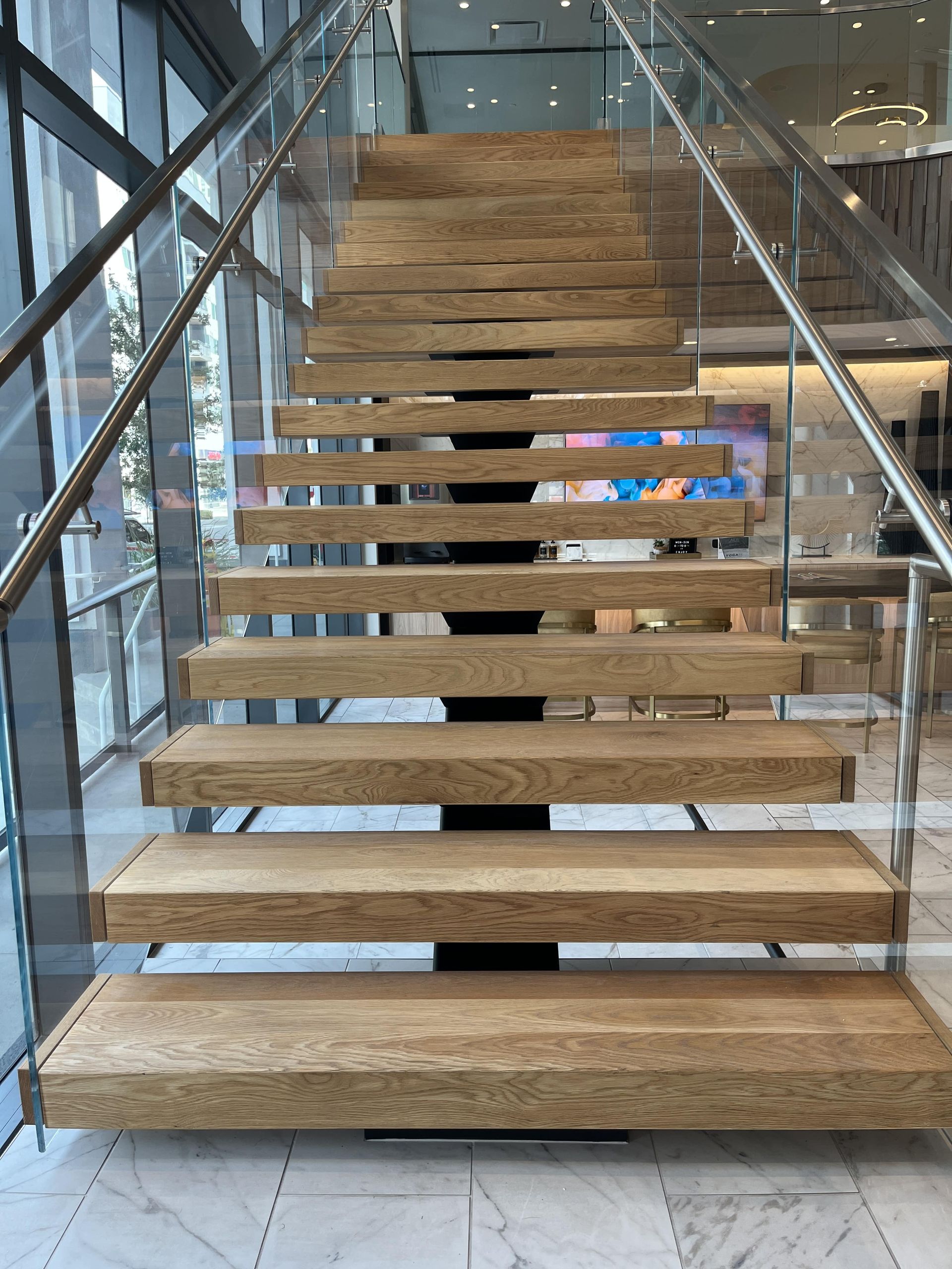 Contemporary glass staircase in San Jose lobby