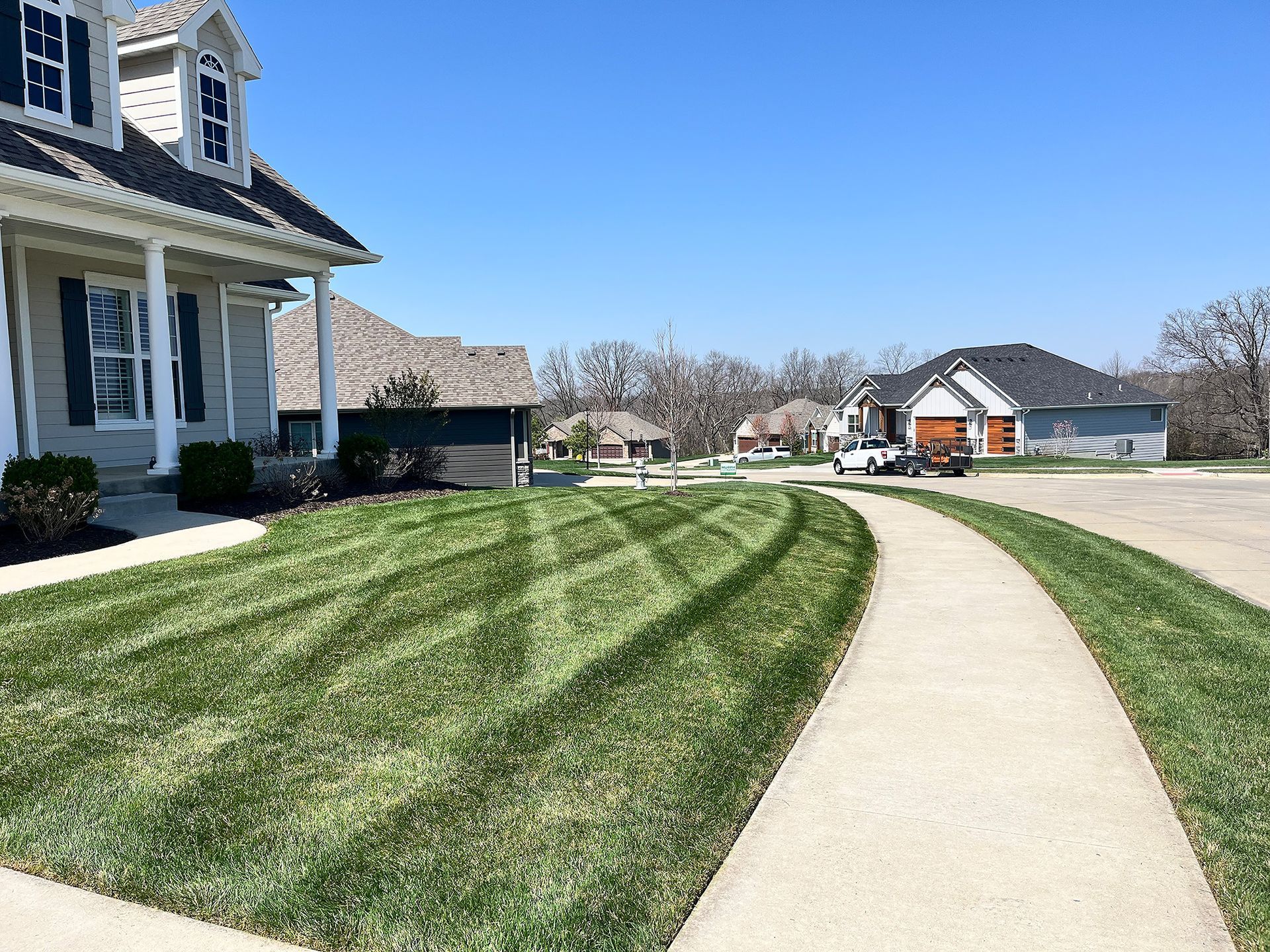 The Outside of Your Columbia, MO Home Will Have Green Grass With Our Expert Lawn Mowing & Care