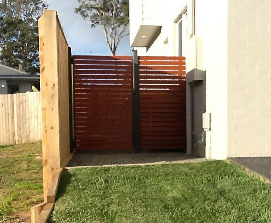 A House with Aluminium Fence and A Wooden Gate — Topline Aluminium Forster Pty Ltd in Tuncurry, NSW