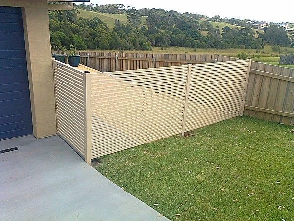 There Is a Fence in The Backyard of A House — Topline Aluminium Forster Pty Ltd in Taree, NSW