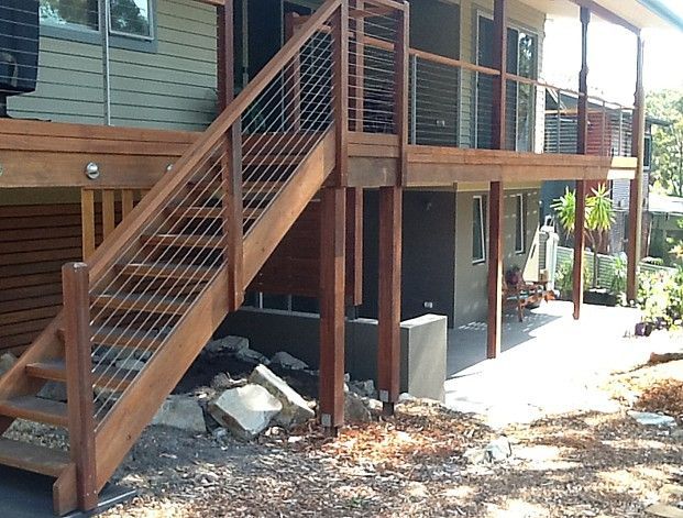 A House with A Balcony and Stairs on The Side of It — Topline Aluminium Forster Pty Ltd in Forster, NSW