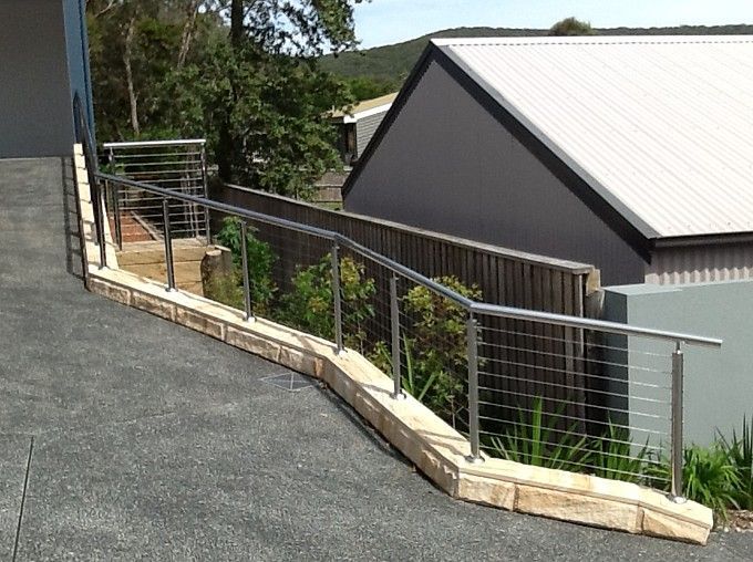 A Large White House with Stairs Leading up To It — Topline Aluminium Forster Pty Ltd in Forster, NSW