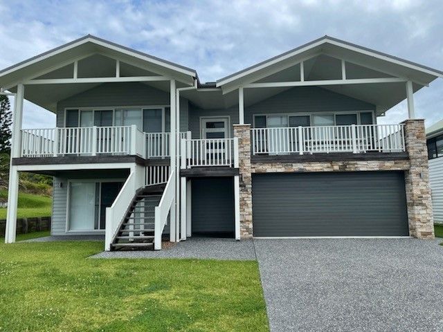 A Large House with A Garage and Stairs — Topline Aluminium Forster Pty Ltd in Tuncurry, NSW