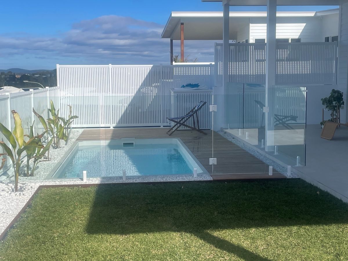 A White House with A Balcony and Stairs Is Being Built — Topline Aluminium Forster Pty Ltd in Forster, NSW