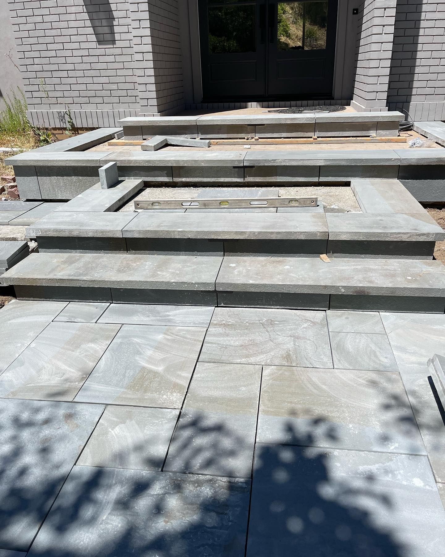 A set of stairs leading up to a brick building.