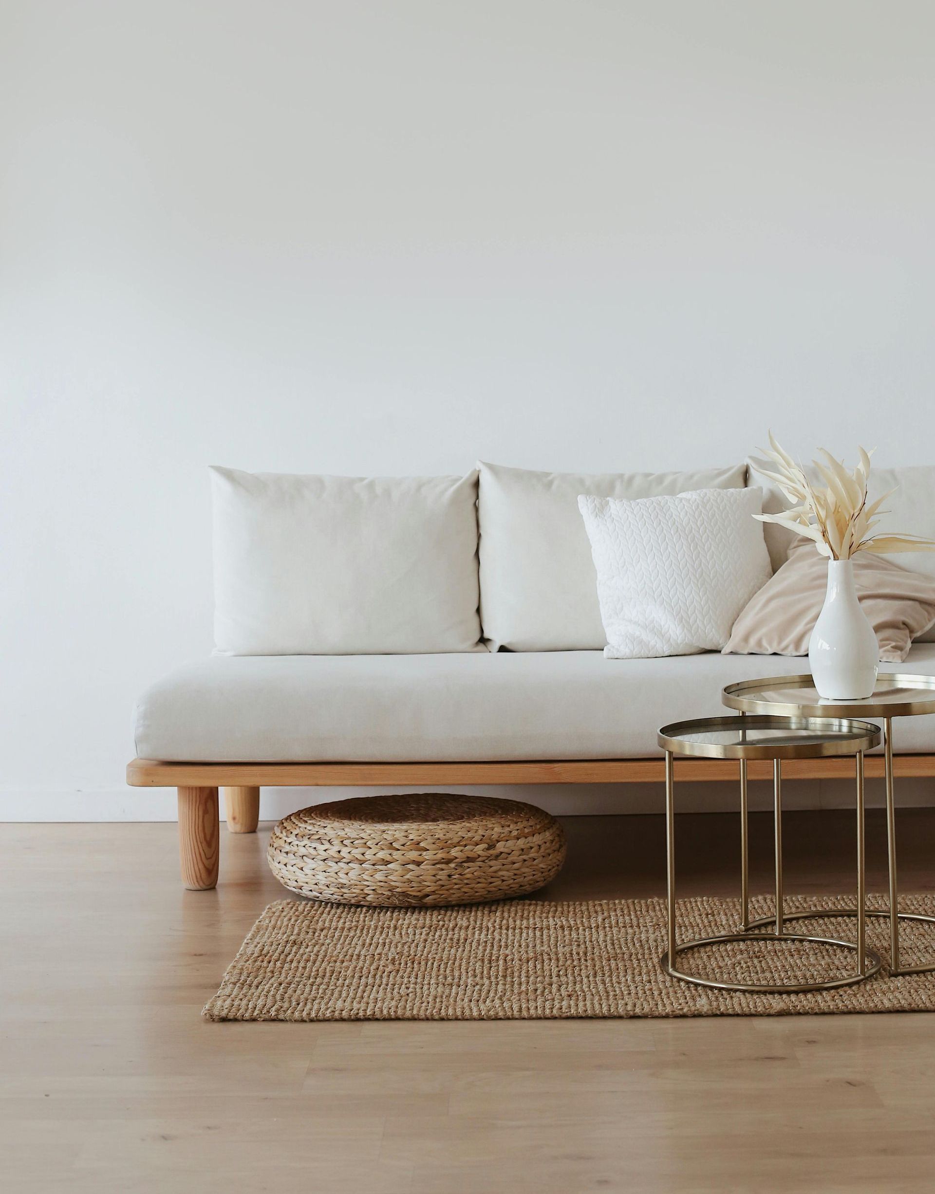A living room with a couch and two tables