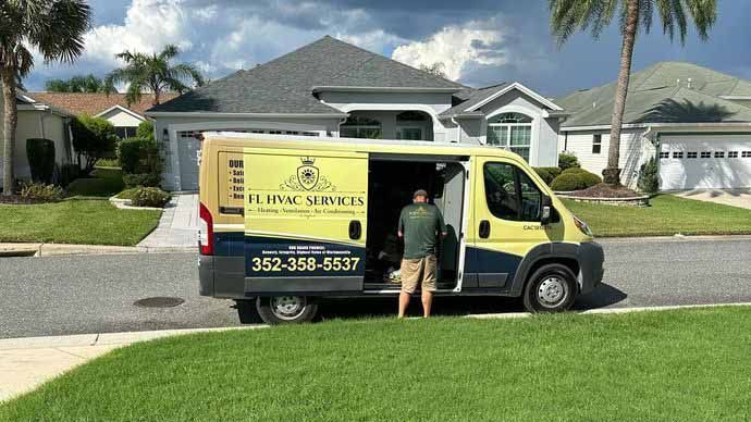 ac service technician performing an ac repair in the villages