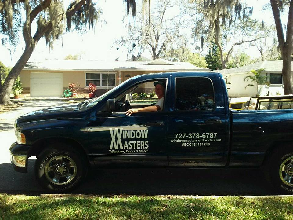 Black Pick Up Car with Driver — New Port Richey, FL — Window Masters of Florida