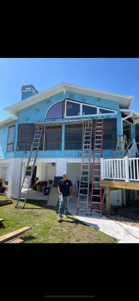 Blue House With Man — New Port Richey, FL — Window Masters of Florida