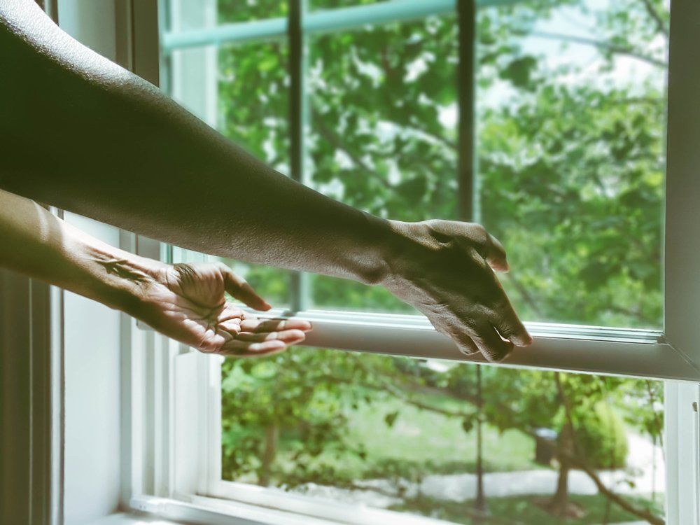 Hands Try to Open Window — New Port Richey, FL — Window Masters of Florida