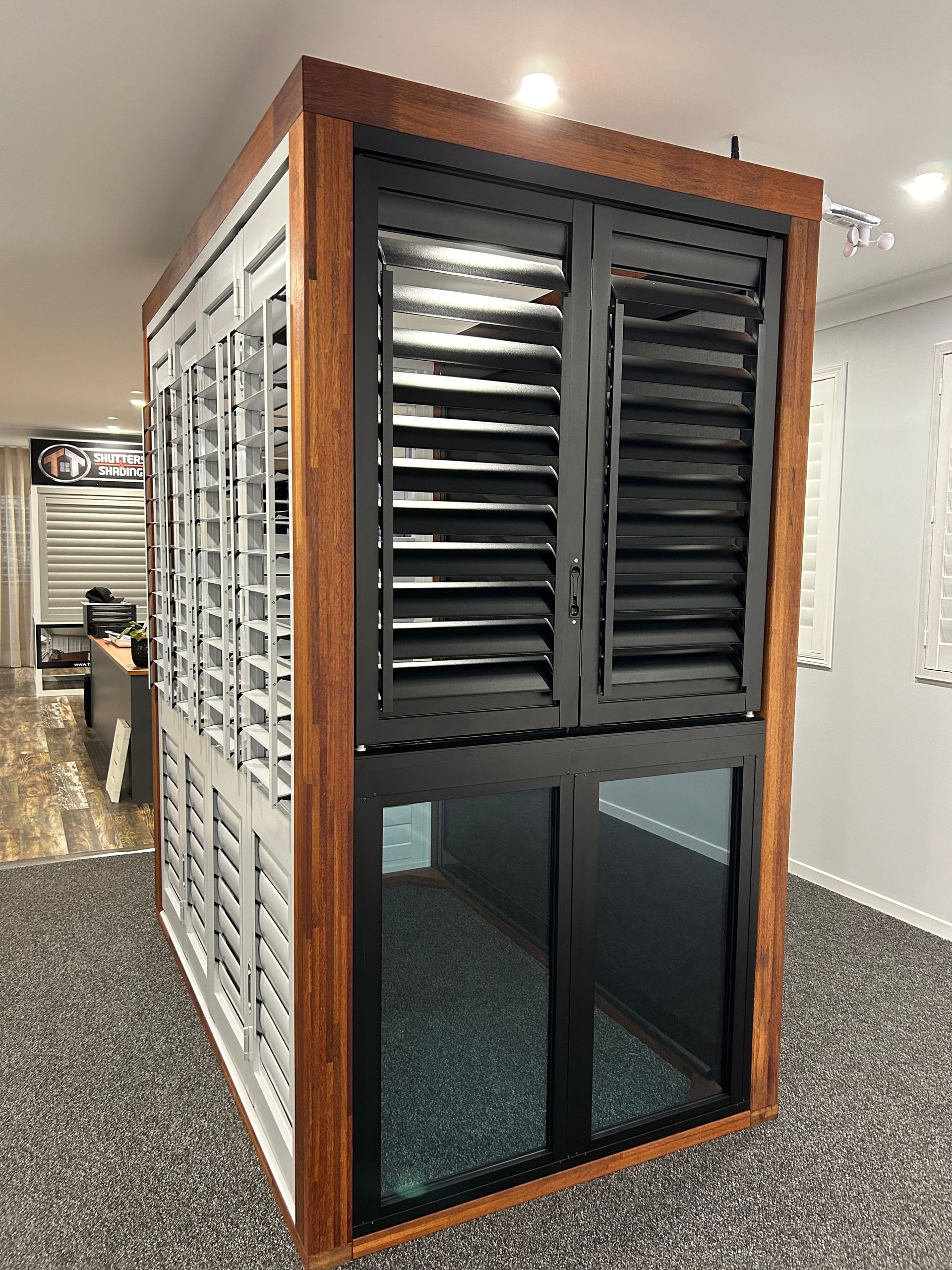 A Room With a Window and Shutters in It — TT Shutters & Shading In Ballina, NSW