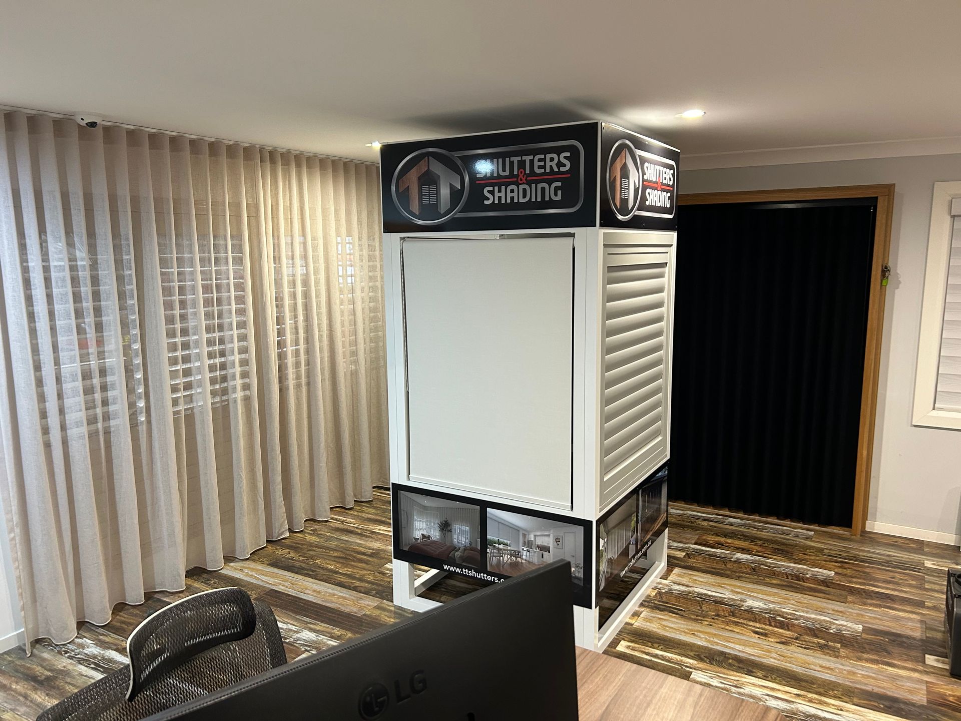 A Living Room With a Display of Blinds and Curtains — TT Shutters & Shading In Ballina, NSW