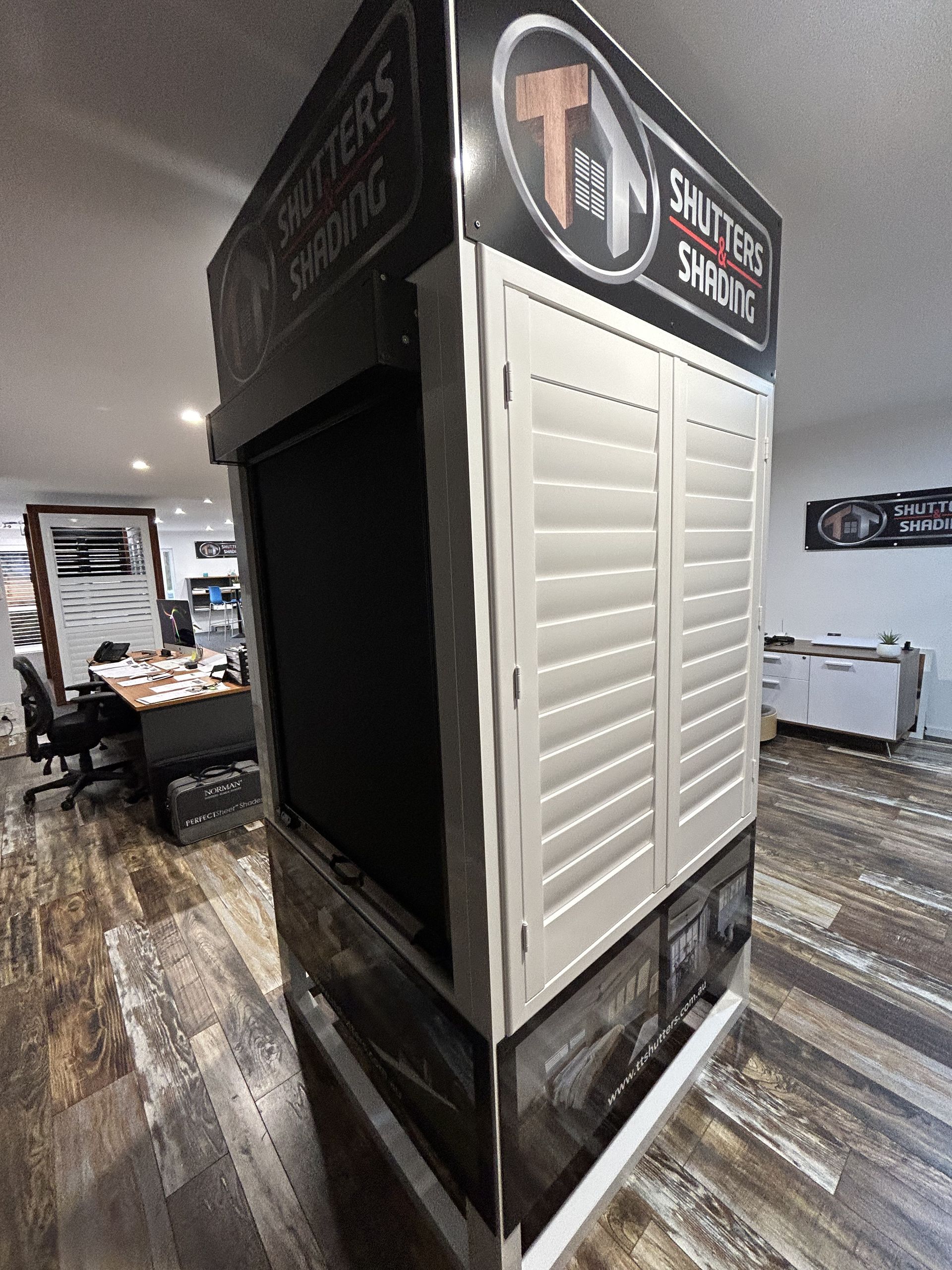 A Display of Shutters in a Room With a Wooden Floor — TT Shutters & Shading In Ballina, NSW