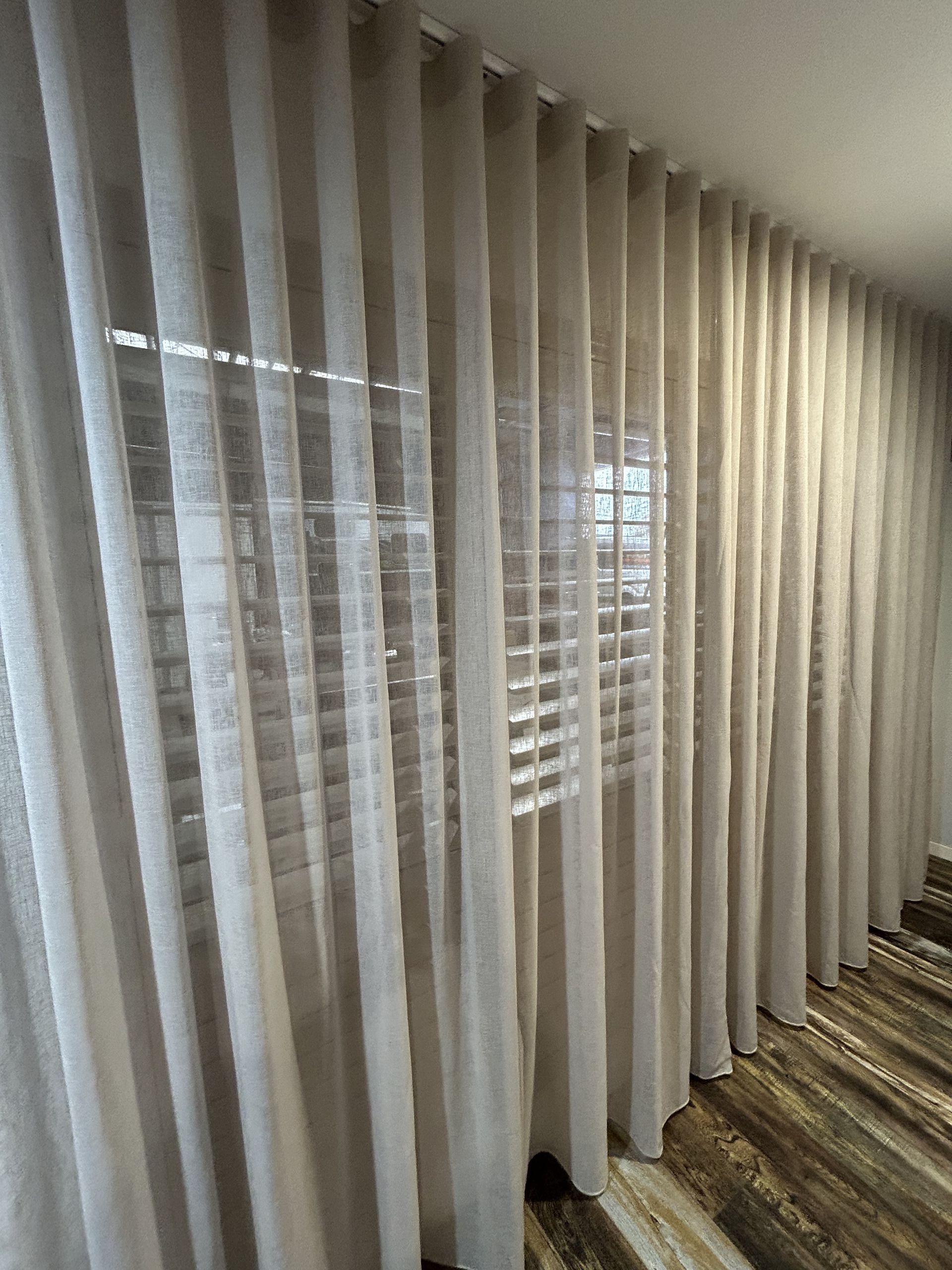 A Room With a Lot of Curtains on the Wall and a Window — TT Shutters & Shading In Ballina, NSW