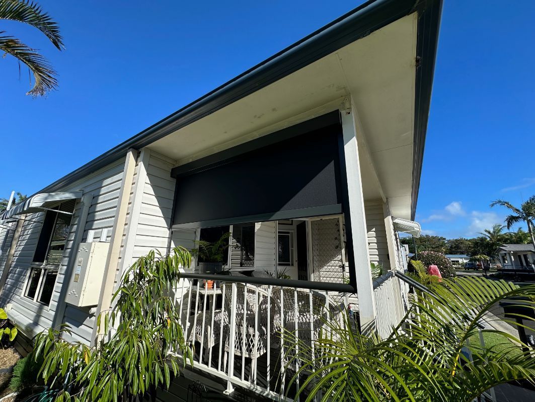 A White House With A Black Screen On The Porch — TT Shutters & Shading In Ballina, NSW