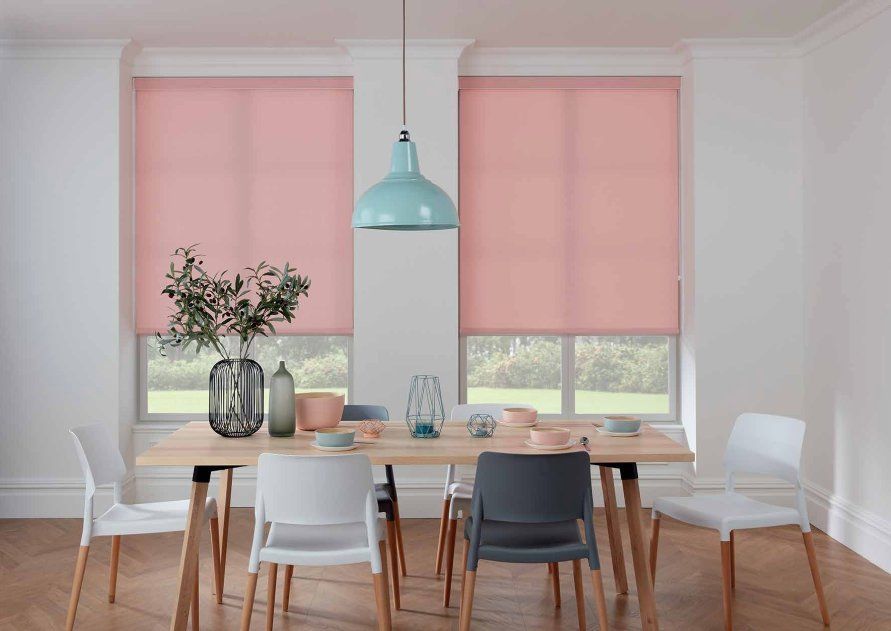 A Dining Room With a Table and Chairs and Pink Blinds on the Windows — TT Shutters & Shading In Ballina, NSW