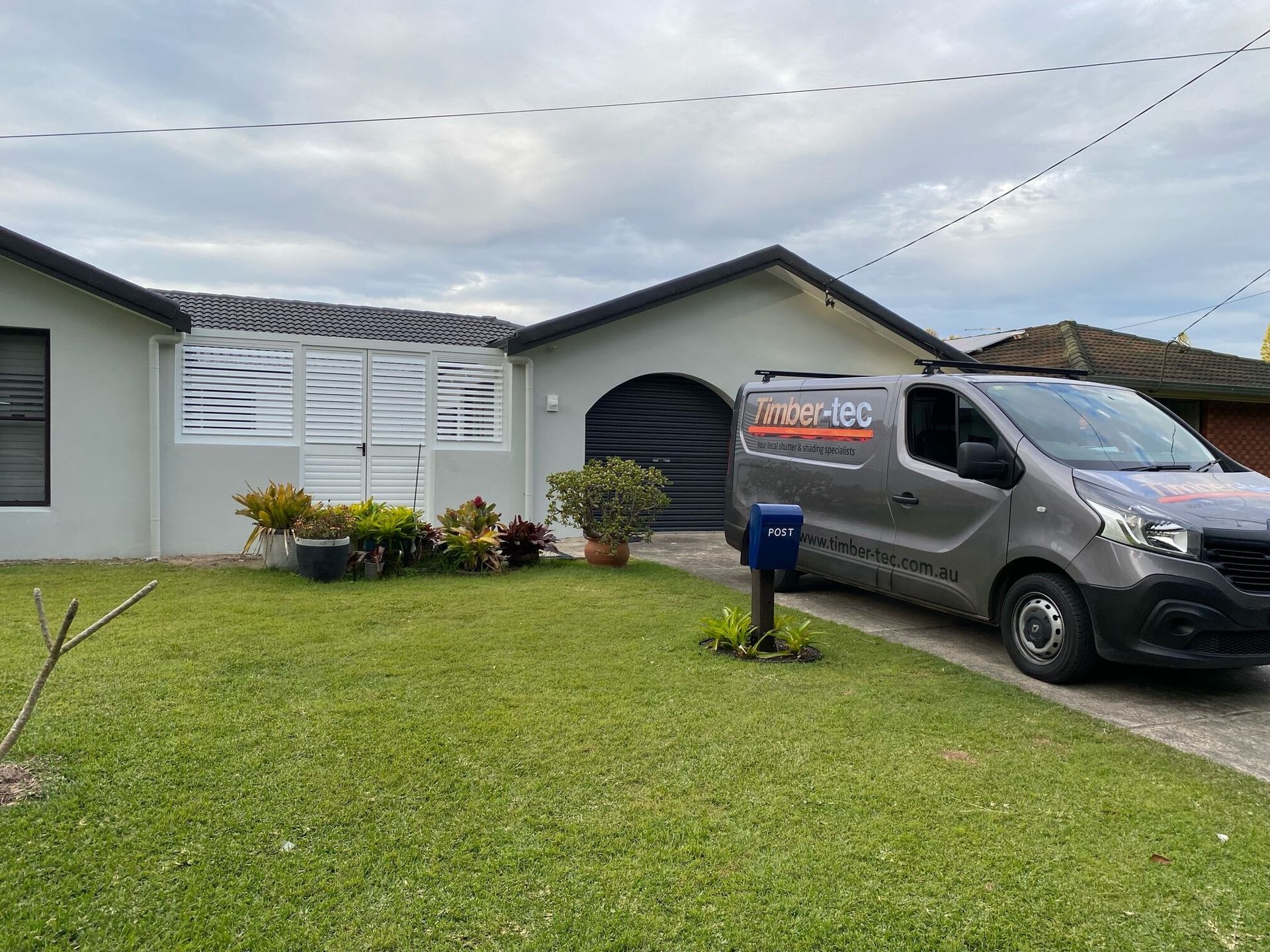 A Van is Parked in Front of a House — TT Shutters & Shading In Ballina, NSW