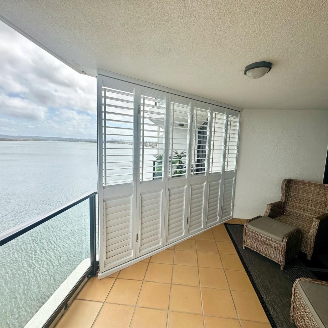 A Balcony With Shutters and a View of the Ocean — TT Shutters & Shading In Ballina, NSW
